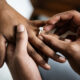person putting a ring on a partners finger