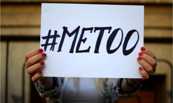 Image of woman holding up sign of #metoo campaign for harassment visability