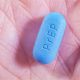 A blue PREP tablet on a palm