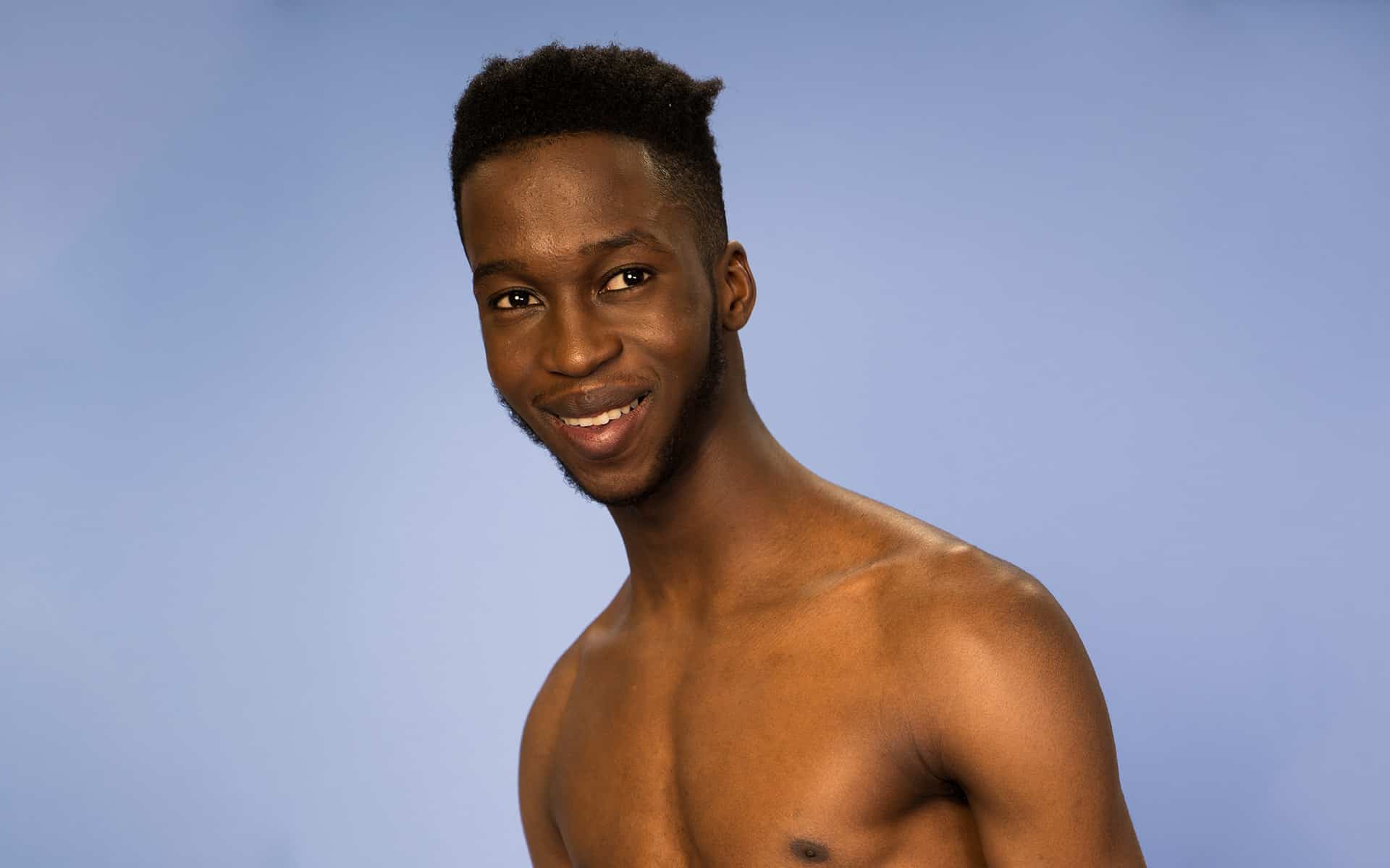 Young man with growing facial hair