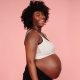pregnant women holding her bare belly