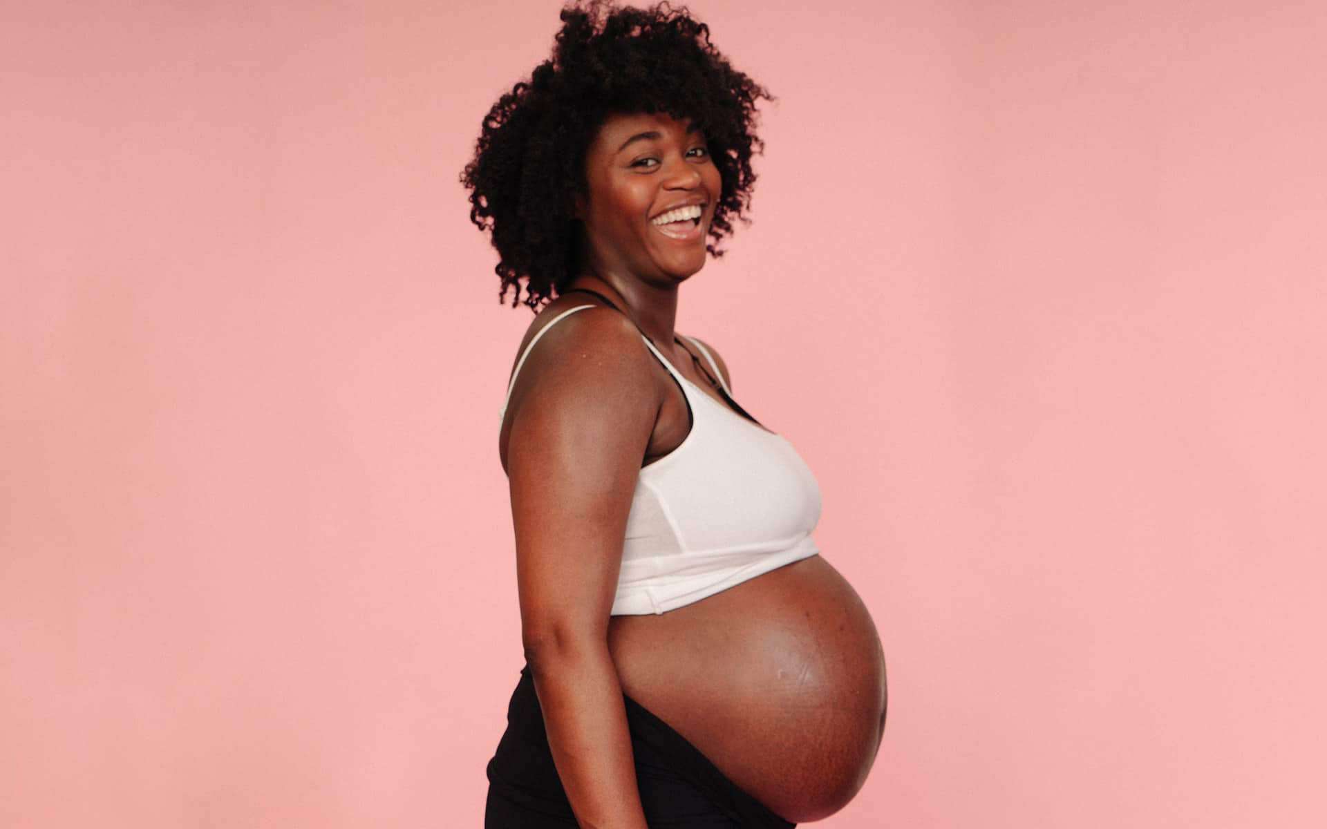 Happy, heavily pregnant woman