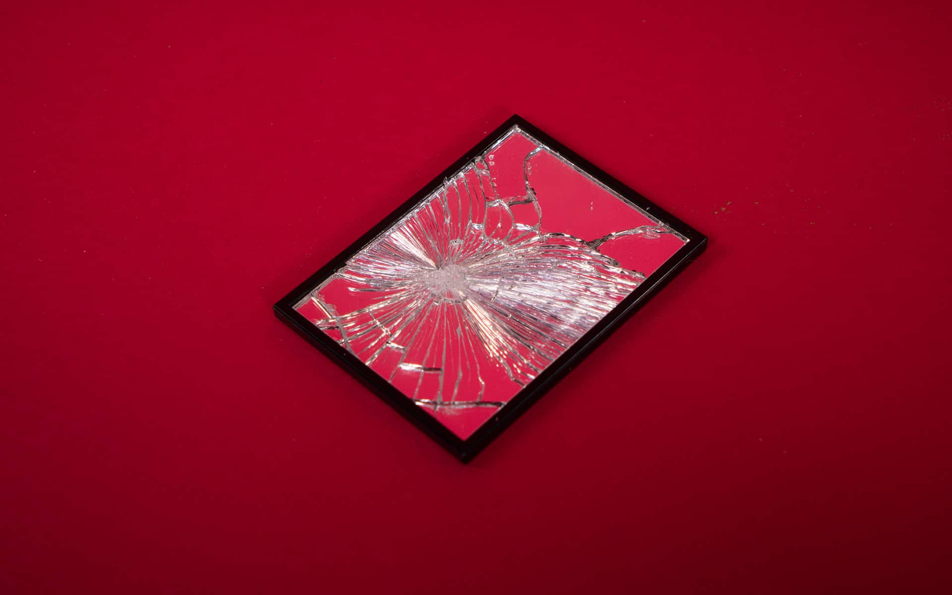 Shattered mirror on the ground
