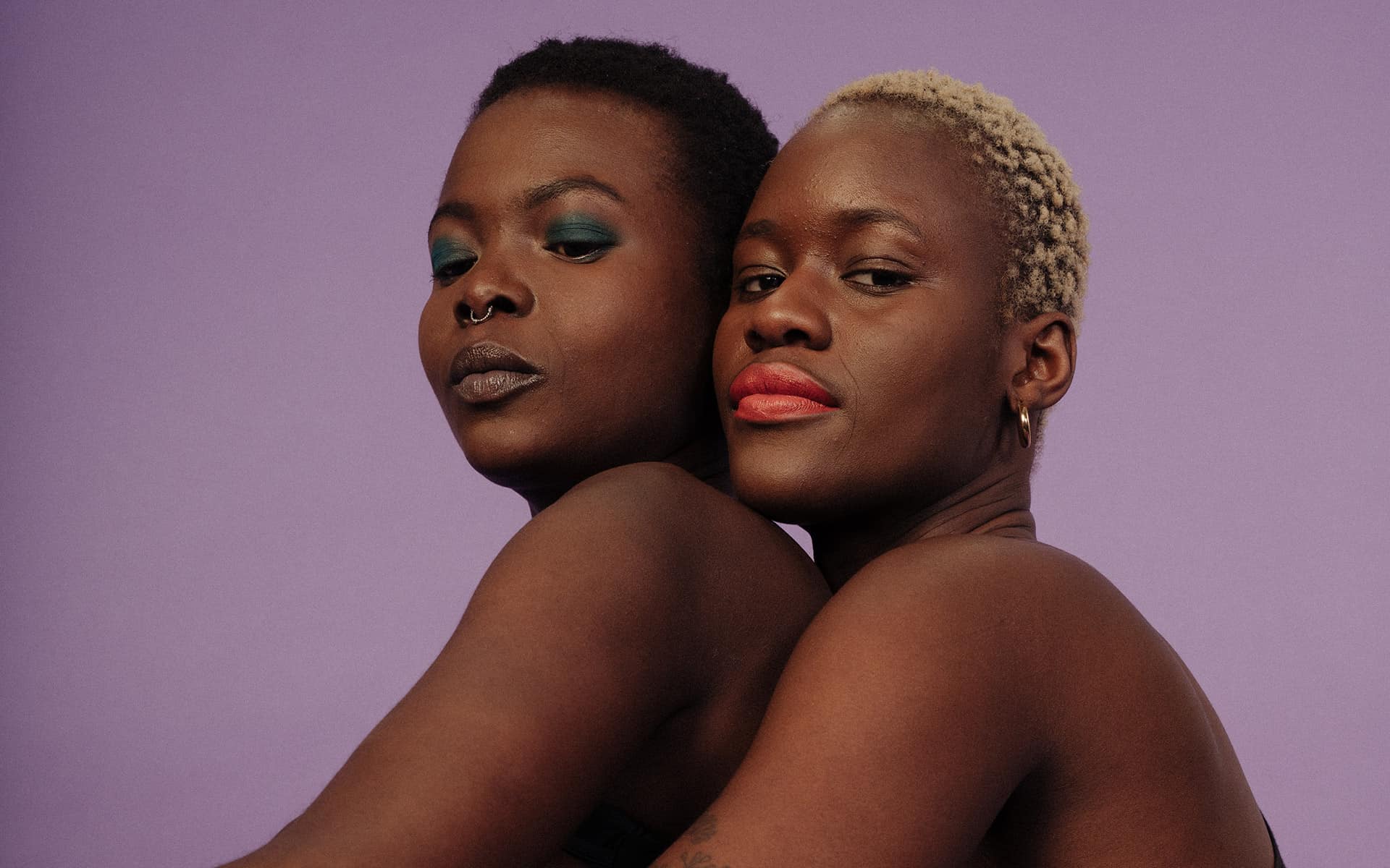 Two women embracing each other