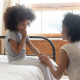 woman talking to a worried girl