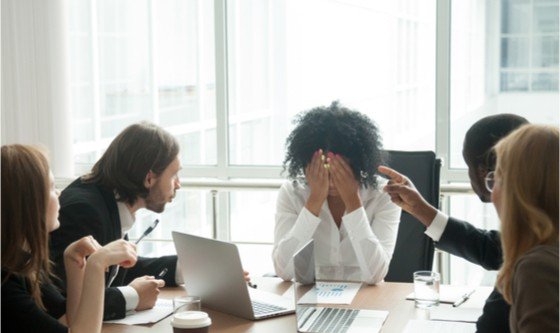 Woman being yelled at in the workplace