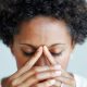 woman bowing and looking worried