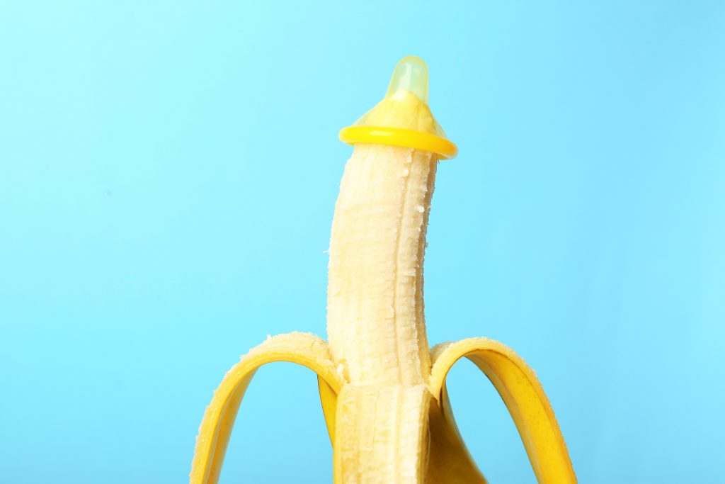 Condom tip put on Halfway pilled banana