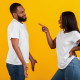 angry woman pointing at man