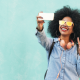 young girl with yellow shades taking a selfie