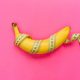 Ripe banana wrapped in tape measure