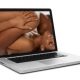 a screen computer showing man and woman laying on each other