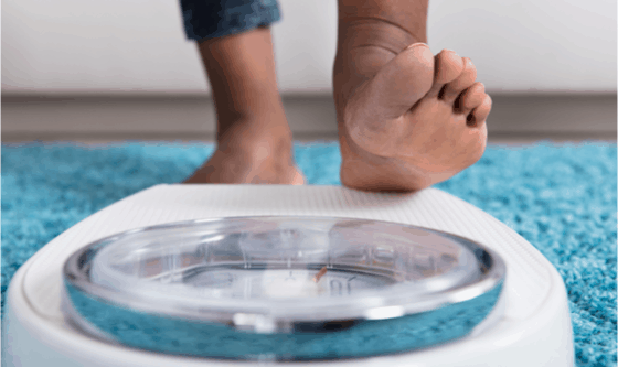 Feet stepping on a scale