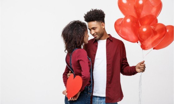 Cute couple with heart and balloons