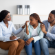 your girl crying seated between man and woman