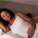 pregnant woman lying in bed
