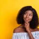 Close-up portrait of attractive curious girl creating new solution copy space isolated over bright yellow color background
