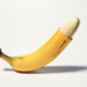 quarter way peeled banana representing a penis